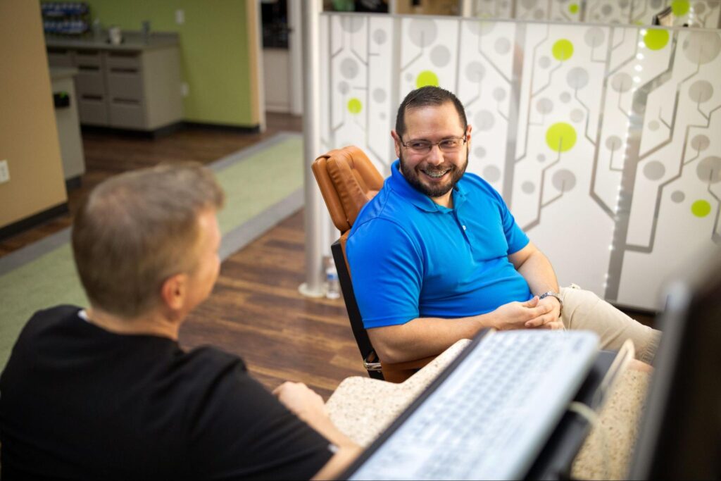 A man discussing his Adult Braces in Lubbock with his Lubbock Orthodontist